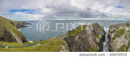 Panorama picture of pedastrian bridge to Mizen Head lighthouse in southern west Ireland during daytime Panorama picture of pedastrian bridge to Mizen Head lighthouse in southern west Ireland during daytime 80850938