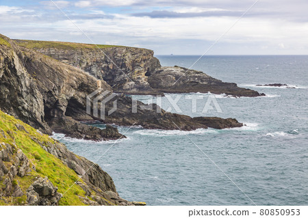 Rough cliff line at Mizen head lighthouse in southern west Ireland during daytime 80850953