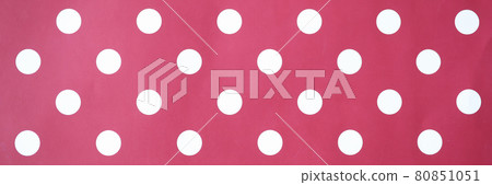 Red background with white circles. Polka dot closeup Red background with white circles. Polka dot closeup 80851051