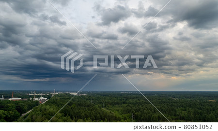 Aerial photo taken with a drone of a dark ominous grey storm clouds. Dramatic sky. lighting in dark Aerial photo taken with a drone of a dark ominous grey storm clouds. Dramatic sky. lighting in dark 80851052