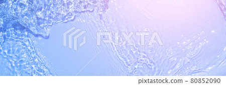 Serum texture close up. Light blue and pink gradient liquid gel background. Transparent beauty skincare sample. Cosmetic clear liquid cream smudge. Long banner with copy space. 80852090