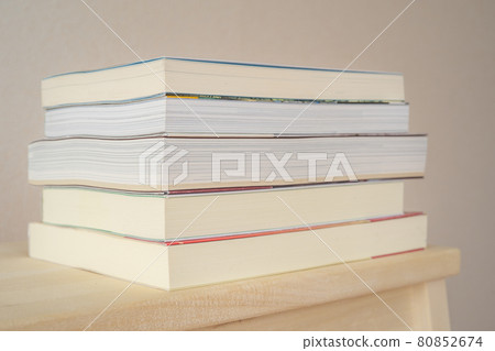 Books stacked on a wooden stepladder Books stacked on a wooden stepladder 80852674