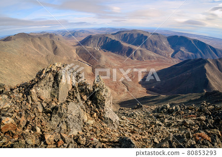 View from the top of the mountain to the valley and mountains. View from the top of the mountain to the valley and mountains. 80853293