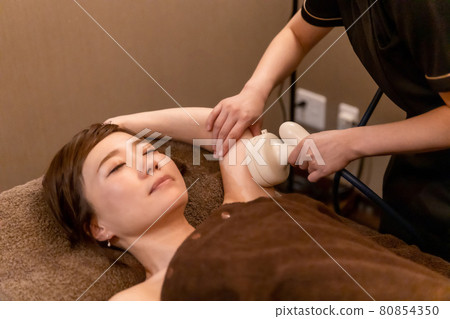 Girl during Massaging Her Arm Stock Image - Image of care