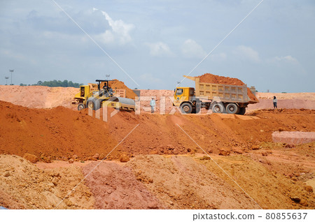 PERAK, MALAYSIA -OCTOBER 01, 2016: Heavy construction machine doing earthwork at the construction site. It is carried out to get required platform level. PERAK, MALAYSIA -OCTOBER 01, 2016: Heavy construction machine doing earthwork at the construction site. It is carried out to get required platform level. 80855637