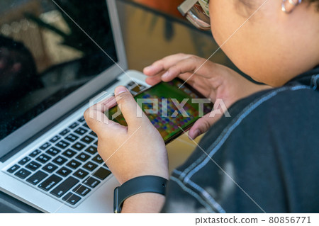 Teenager playing mobile games on smartphone Teenager playing mobile games on smartphone 80856771