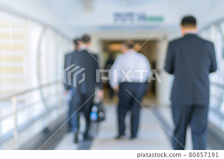 Blurred of people or Passengers walking in the modern building station. motion blur Blurred of people or Passengers walking in the modern building station. motion blur 80857191