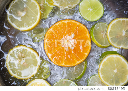 Summer drinks refreshing of cold drinks fresh fruit on ice bucket homemade cocktail tea with mojito lemon lime orange slice, summer drink juicy 80858495