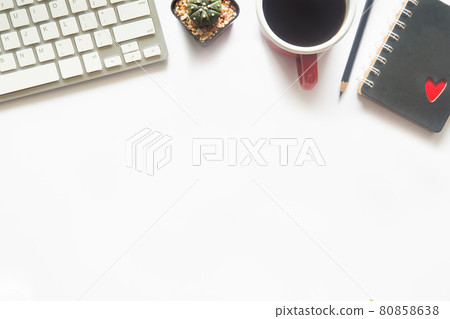 White desk office with laptop, smartphone and other work supplies with cup of coffee. Top view with copy space for input the text. Designer workspace on desk table essential elements on flat lay. 80858638