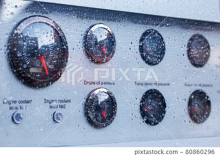 raindrops on the protective glass of the dashboard 80860296
