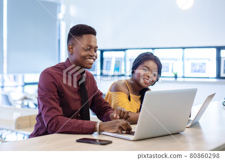 business man and women African American black skin addressing working with laptop corporate. 80860298