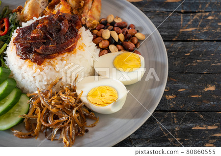 Nasi lemak is a Malay fragrant rice dish cooked in coconut milk and pandan leaf. 80860555