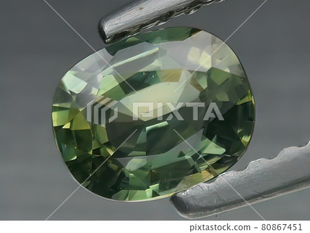 Natural gemstone sapphire. Natural sapphire in tongs 80867451