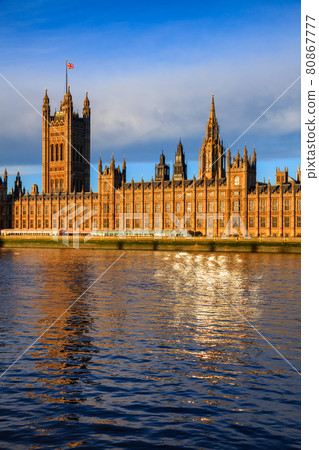 Palace of Westminster windows reflecting in River Thames London UK 80867777