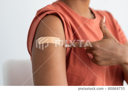 Unrecognizable patient pointing at medial band on her arm Unrecognizable patient pointing at medial band on her arm 80869735