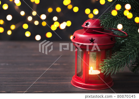 Christmas composition with red lantern and fir branches on wooden background. Christmas composition with red lantern and fir branches on wooden background. 80870145