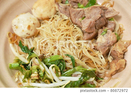 boiled dry vermicelli thin rice noodles topping slice braised pork and meatball dressing sweet black soybean sauce on bowl boiled dry vermicelli thin rice noodles topping slice braised pork and meatball dressing sweet black soybean sauce on bowl 80872972