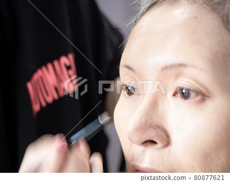 Senior asian woman and make up artist. Senior asian woman and make up artist. 80877621