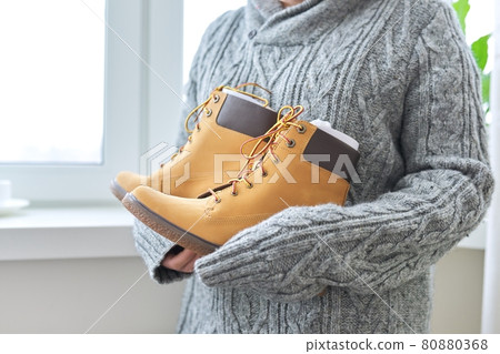 New womens leather brown waterproof hiking winter autumn boots in hands of female 80880368