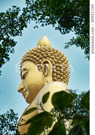 Giant golden buddha statue of Dhammakaya Thep Mongkol Buddha in construction site located at Wat Paknam Bhasicharoen temple 80881199