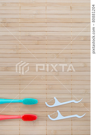 Teeth hygiene and oral dental care products. Dental toothbrushes. Oral care kit. Flat lay. Copy space. Text. Health care. Vertical Teeth hygiene and oral dental care products. Dental toothbrushes. Oral care kit. Flat lay. Copy space. Text. Health care. Vertical 80881204