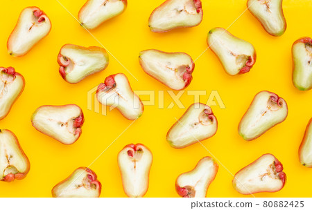 Fresh rose apple on yellow background. Fresh rose apple on yellow background. 80882425