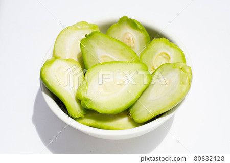 Fresh chayote fruit on white background. Fresh chayote fruit on white background. 80882428