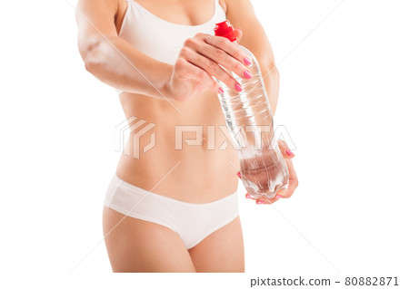 Body of woman with bottle water on white. 80882871