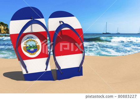 Flip flops with Costa Rican flag on the beach. Costa Rica resorts, vacation, tours, travel packages concept. 3D rendering Flip flops with Costa Rican flag on the beach. Costa Rica resorts, vacation, tours, travel packages concept. 3D rendering 80883227
