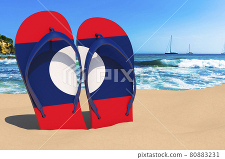 Flip flops with Laotian flag on the beach. Laos resorts, vacation, tours, travel packages concept. 3D rendering Flip flops with Laotian flag on the beach. Laos resorts, vacation, tours, travel packages concept. 3D rendering 80883231