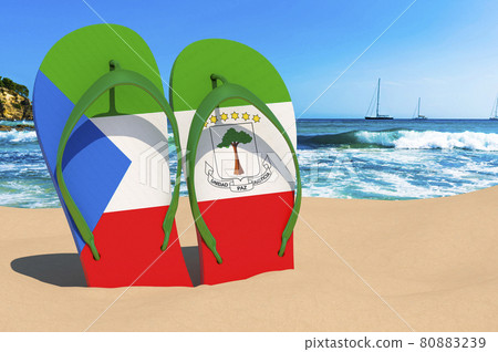 Flip flops with Equatoguinean flag on the beach. Equatorial Guinea resorts, vacation, tours, travel packages concept. 3D rendering Flip flops with Equatoguinean flag on the beach. Equatorial Guinea resorts, vacation, tours, travel packages concept. 3D rendering 80883239