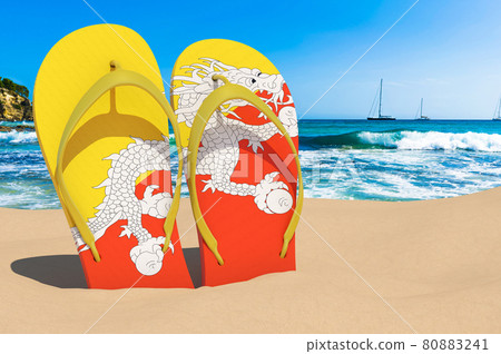 Flip flops with Bhutanese flag on the beach. Bhutan resorts, vacation, tours, travel packages concept. 3D rendering Flip flops with Bhutanese flag on the beach. Bhutan resorts, vacation, tours, travel packages concept. 3D rendering 80883241