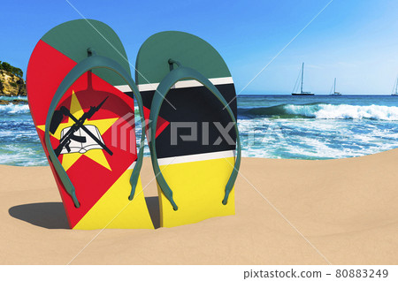Flip flops with Mozambican flag on the beach. Mozambique resorts, vacation, tours, travel packages concept. 3D rendering Flip flops with Mozambican flag on the beach. Mozambique resorts, vacation, tours, travel packages concept. 3D rendering 80883249
