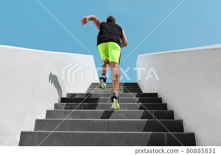Stairs exercise fitess man running fast up the staircase for hiit cardio workout run at outdoor gym. Sport active athlete lifestyle training legs muscles. Stairs exercise fitess man running fast up the staircase for hiit cardio workout run at outdoor gym. Sport active athlete lifestyle training legs muscles. 80885831