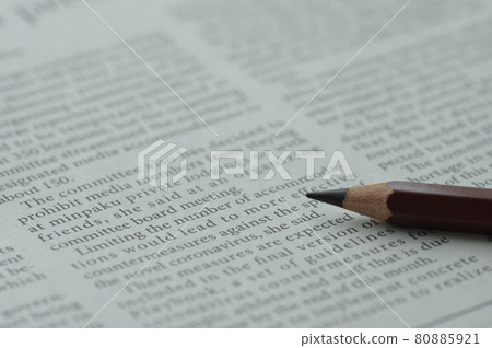 English newspaper and pencil 80885921