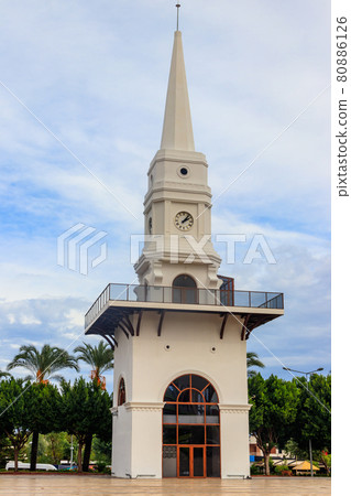 White clock tower in the center of Kemer, Antalya province, Turkey 80886126