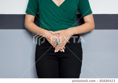 Incontinence problem,Hands woman holding her crotch,Female need to pee Incontinence problem,Hands woman holding her crotch,Female need to pee 80886423