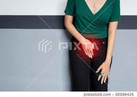 Incontinence problem,Hands woman holding her crotch,Female need to pee Incontinence problem,Hands woman holding her crotch,Female need to pee 80886426