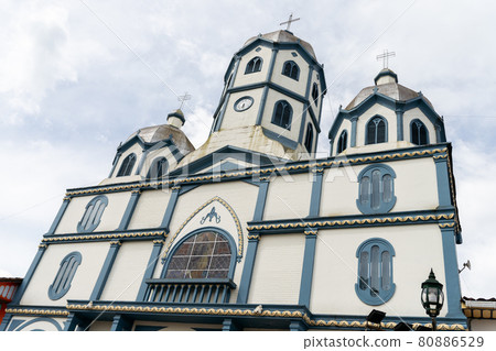 Low angle shot of a church under the clouds 80886529