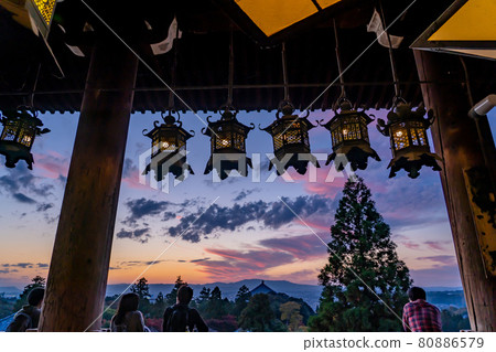 Todaiji Temple, Nara Prefecture People watching the beautiful evening view from the stage of Nigatsudo, which is famous for water removal 80886579