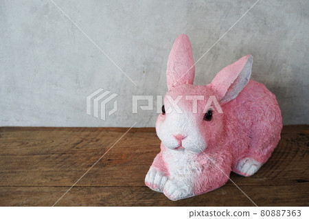 Bunny rabbit with space copy on concrete and wooden background Bunny rabbit with space copy on concrete and wooden background 80887363