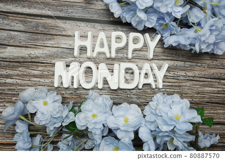 Happy Monday alphabet letter with flower decoration on wooden background 80887570