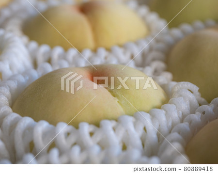 White peach in season in summer. Sweet and delicious peaches. 80889418