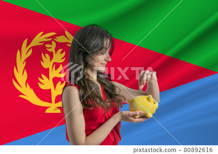 Economy in Eritrea Accumulating and saving money in Eritrea Woman putting money coin in piggy bank for saving money and plan finance Economy in Eritrea Accumulating and saving money in Eritrea Woman putting money coin in piggy bank for saving money and plan finance 80892616