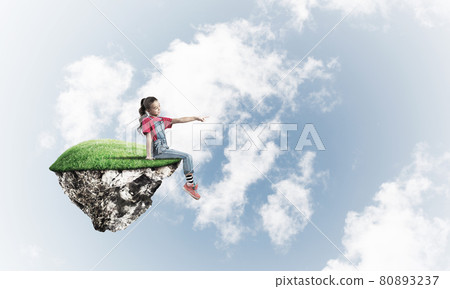 Concept of careless happy childhood with girl showing touch gesture Concept of careless happy childhood with girl showing touch gesture 80893237