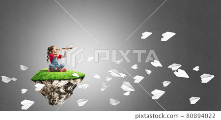 Concept of careless happy childhood with girl looking in spyglass Concept of careless happy childhood with girl looking in spyglass 80894022