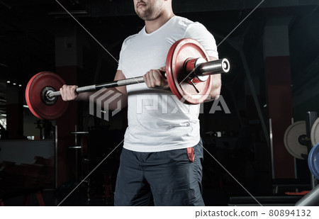 Male athlete lifts the barbell Male athlete lifts the barbell 80894132