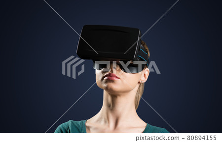 Young woman in VR glasses 80894155
