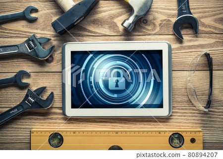 Web security and technology concept with tablet pc on wooden table 80894207