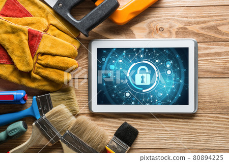 Web security and technology concept with tablet pc on wooden table Web security and technology concept with tablet pc on wooden table 80894225